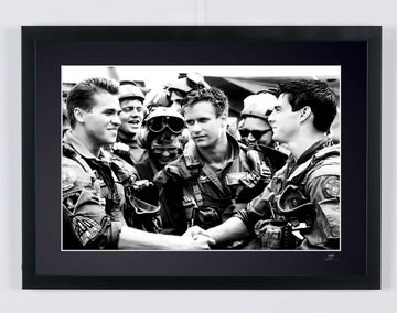 Top Gun (1986) - Tom Cruise (Maverick) & Val Kilmer (Iceman), surrounded by the pilots