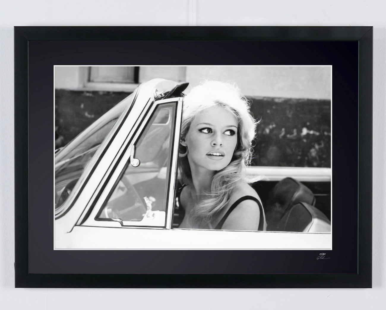 Fine art photograph of Brigitte Bardot in Brigitte Bardot - Renault Floride - Saint-Tropez 1959, hand-framed — limited edition of 30 numbered prints.