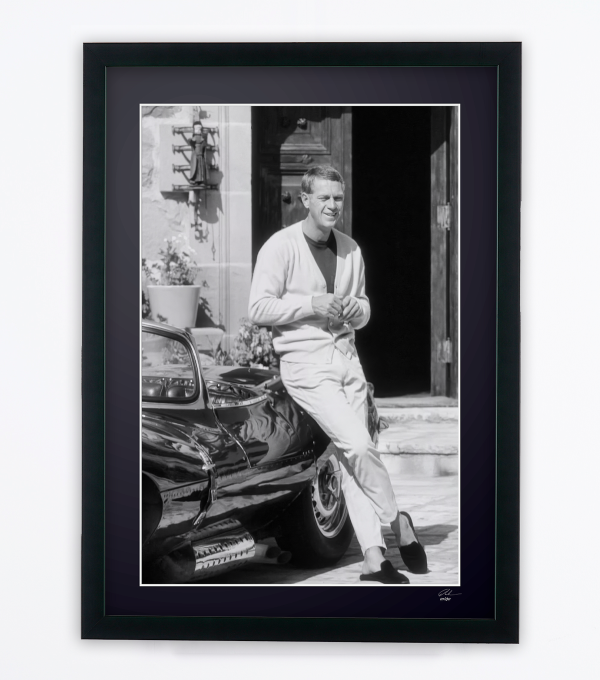 Fine art photograph of Steve McQueen in Steve McQueen — at home with his Jaguar, 1966, hand-framed — limited edition of 30 numbered prints.